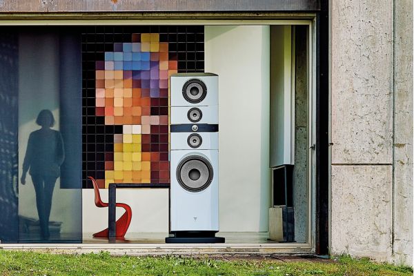 Control4 Touch panel in a able with a traditional home in the background