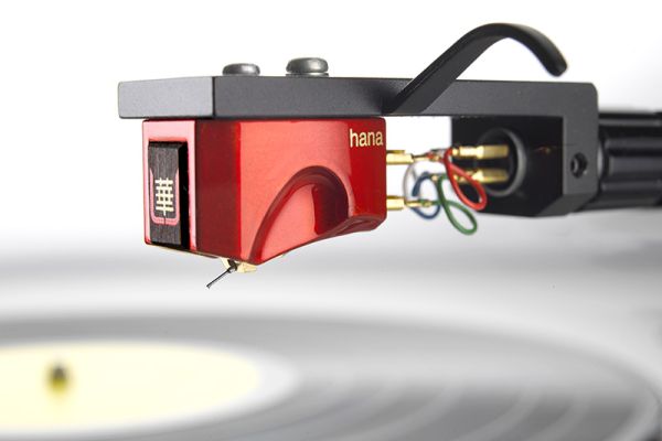 Control4 Touch panel in a able with a traditional home in the background