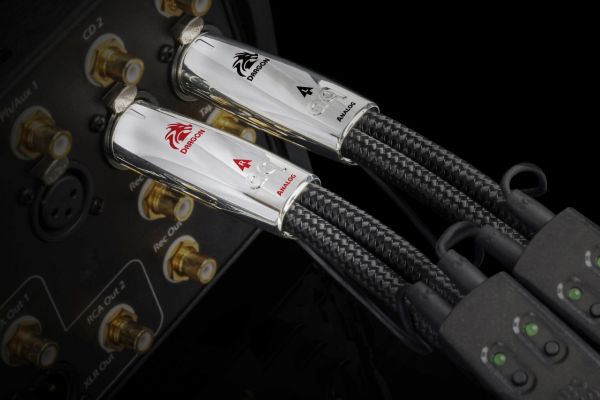 Control4 Touch panel in a able with a traditional home in the background